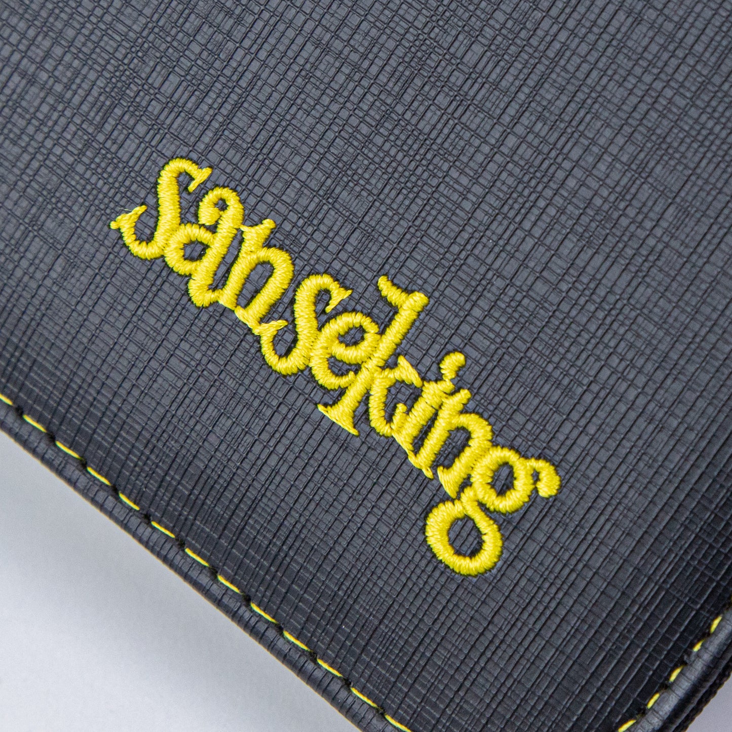 Black Grid 4/9/12-Pocket PU Binder with Waffle Pages