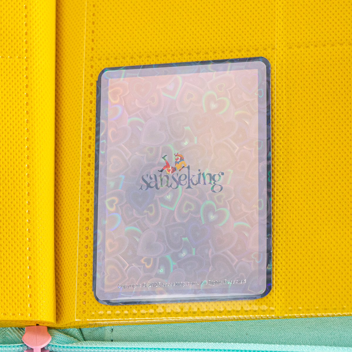 Love Heart-Shape Laser Flashing Rounded Card Sleeves – Black card sleeve stored in a binder page