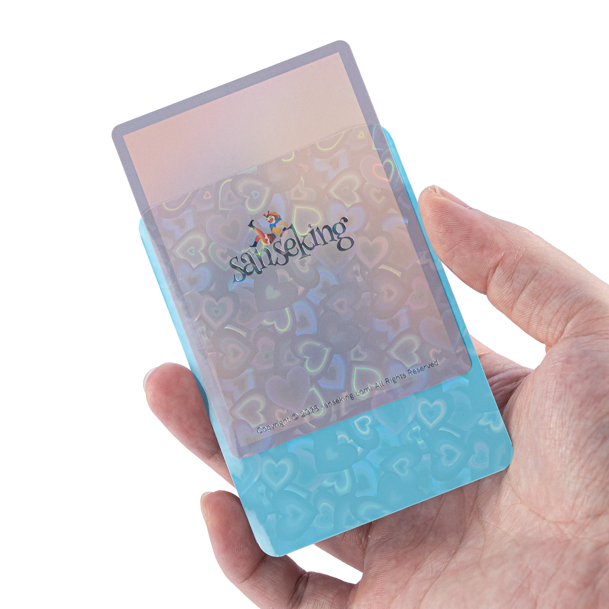Love Heart-Shape Laser Flashing Rounded Card Sleeves – Blue card sleeve held in hand