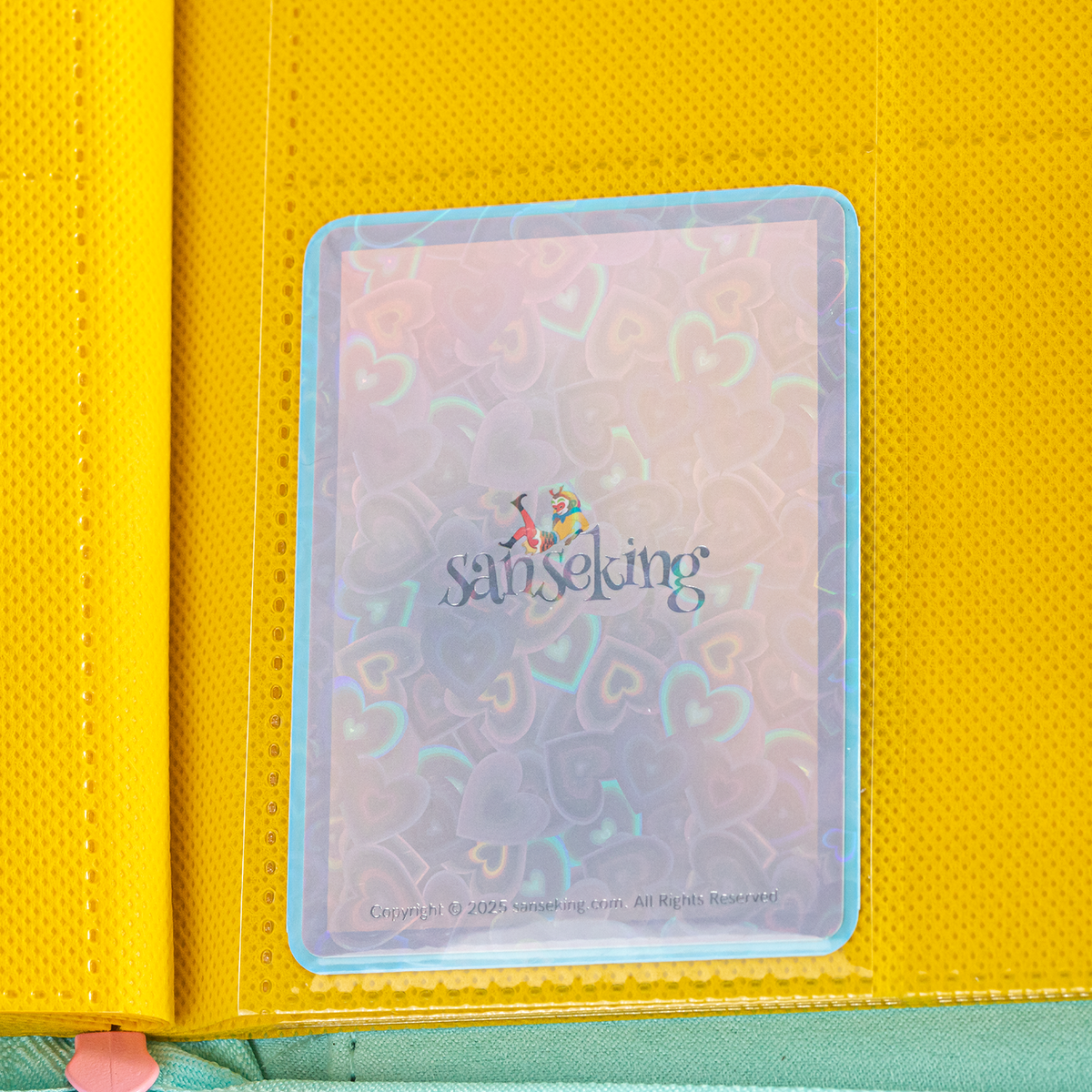 Love Heart-Shape Laser Flashing Rounded Card Sleeves – Blue card sleeve stored in a binder page