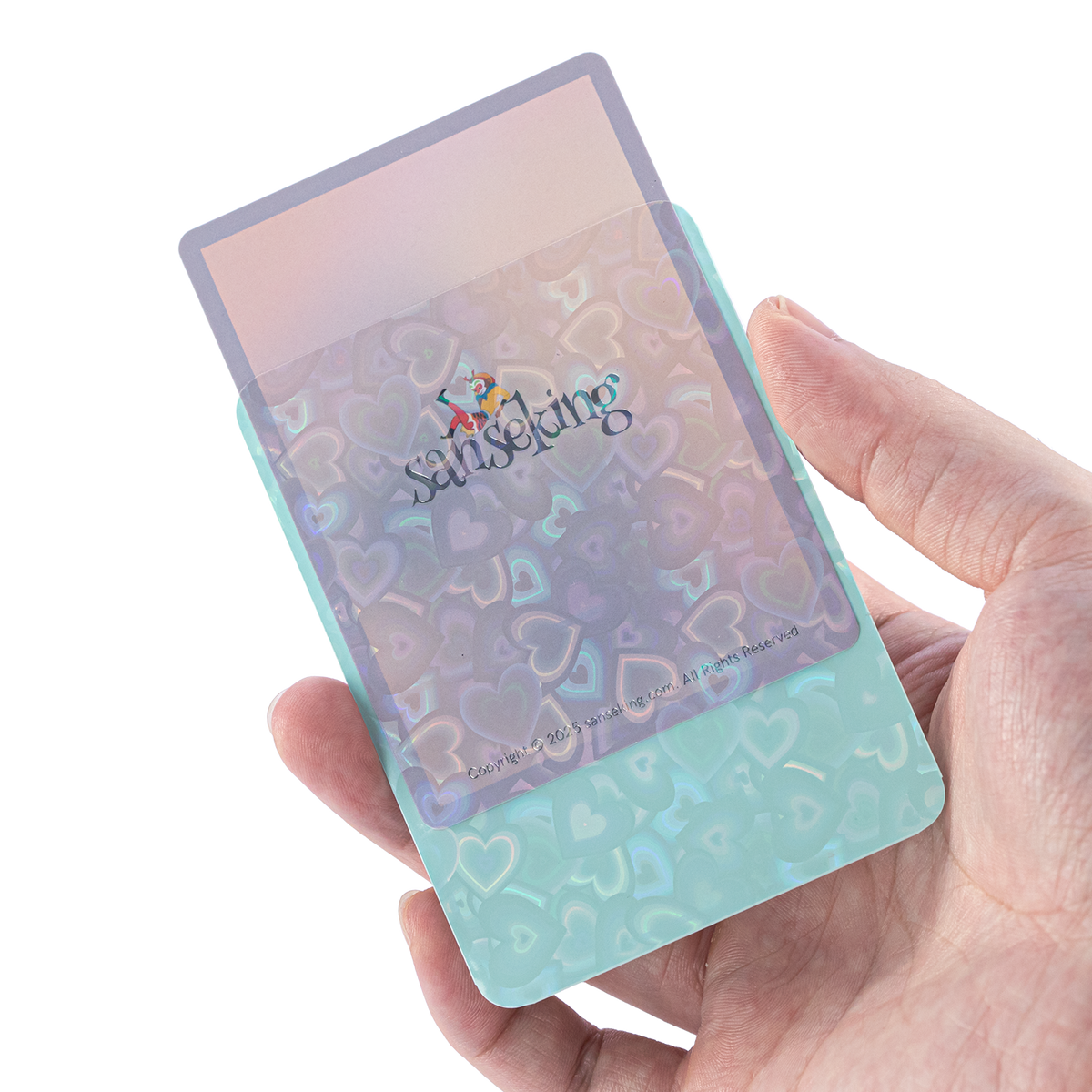 Love Heart-Shape Laser Flashing Rounded Card Sleeves – Green card sleeve held in hand