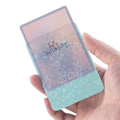 Love Heart-Shape Laser Flashing Rounded Card Sleeves – Green card sleeve held in hand