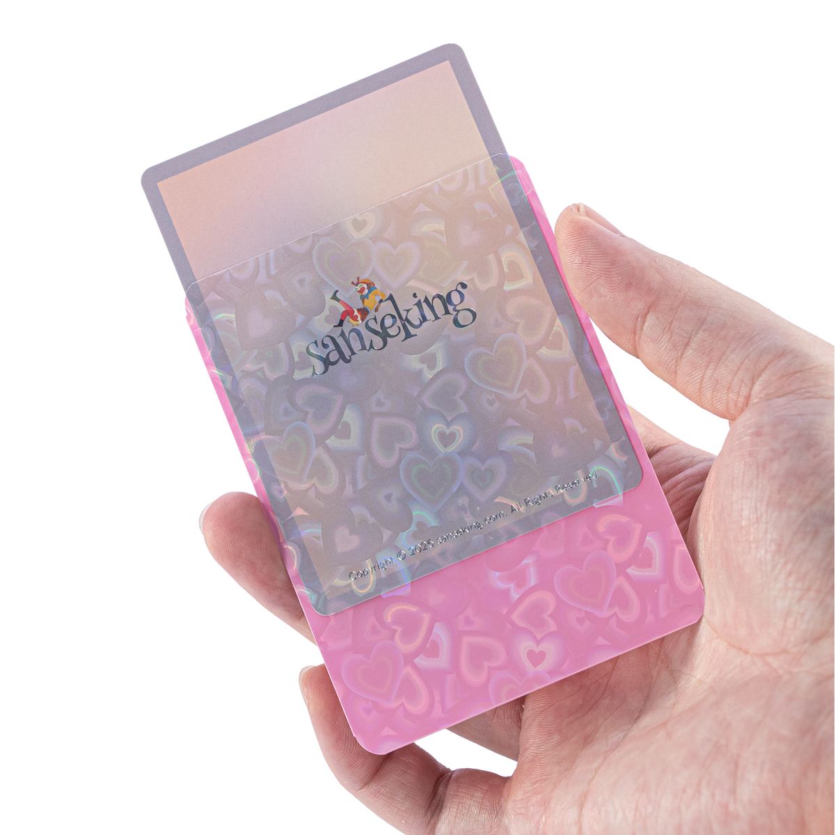 Love Heart-Shape Laser Flashing Rounded Card Sleeves – Pink card sleeve held in hand