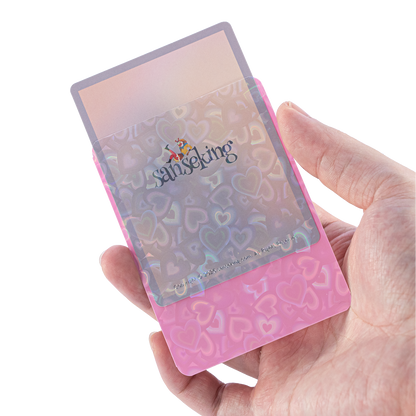 Love Heart-Shape Laser Flashing Rounded Card Sleeves – Pink card sleeve held in hand
