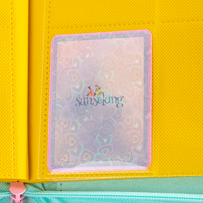 Love Heart-Shape Laser Flashing Rounded Card Sleeves – Pink card sleeve stored in a binder page