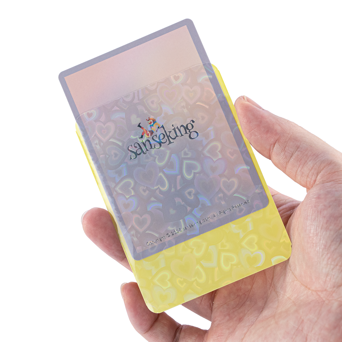 Love Heart-Shape Laser Flashing Rounded Card Sleeves – Yellow card sleeve held in hand