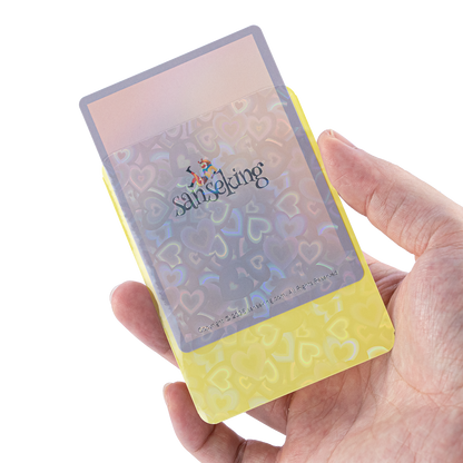 Love Heart-Shape Laser Flashing Rounded Card Sleeves – Yellow card sleeve held in hand
