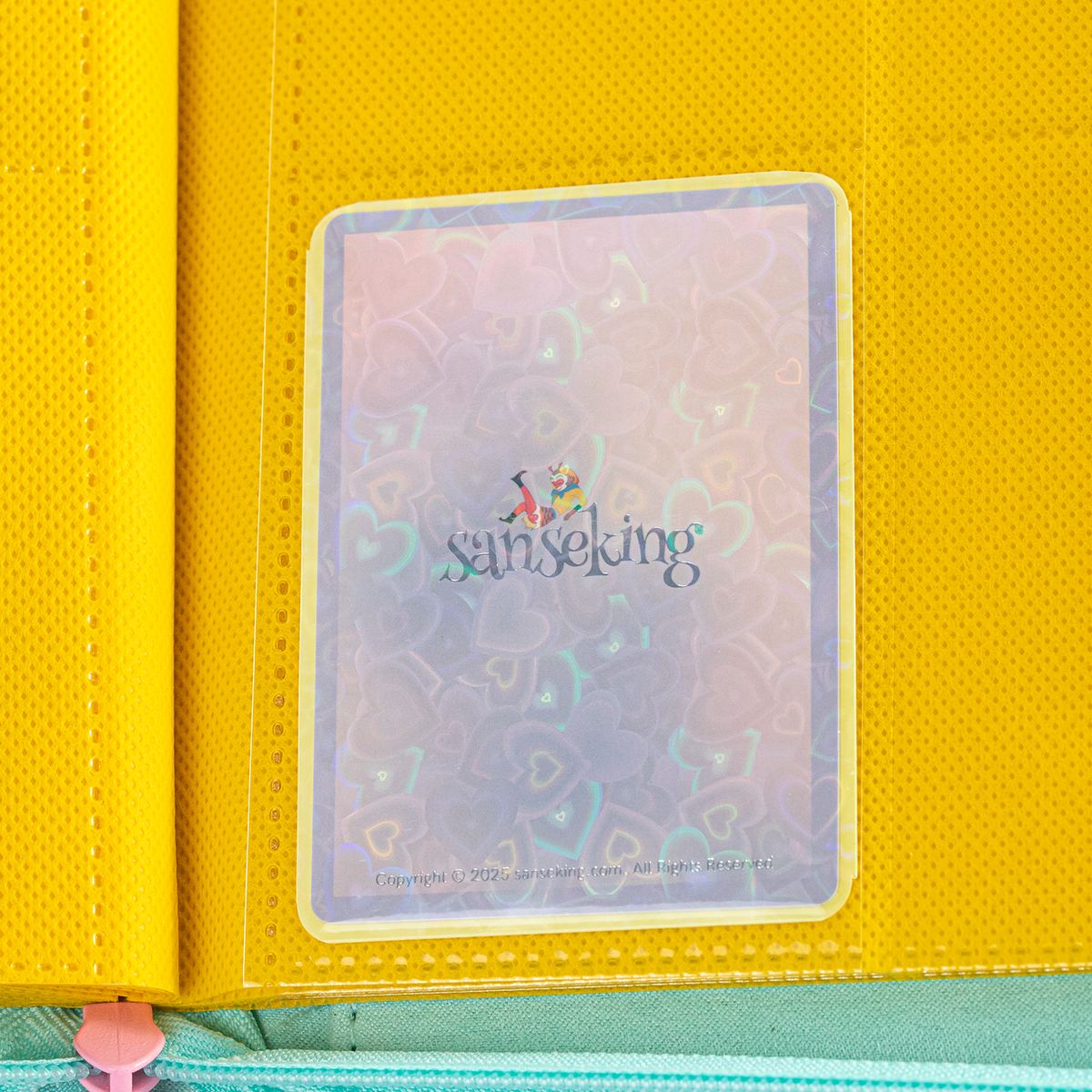 Love Heart-Shape Laser Flashing Rounded Card Sleeves – Yellow card sleeve stored in a binder page
