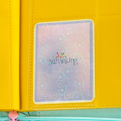 Love Heart-Shape Laser Flashing Rounded Card Sleeves – Yellow card sleeve stored in a binder page