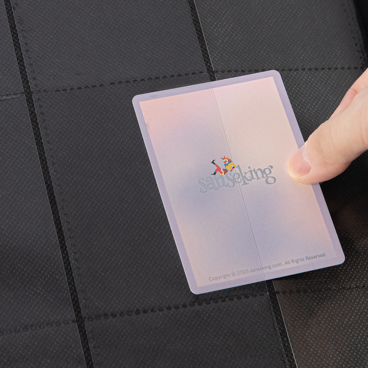 Side-loading pocket holding a sleeved card in the Black SAKURA binder