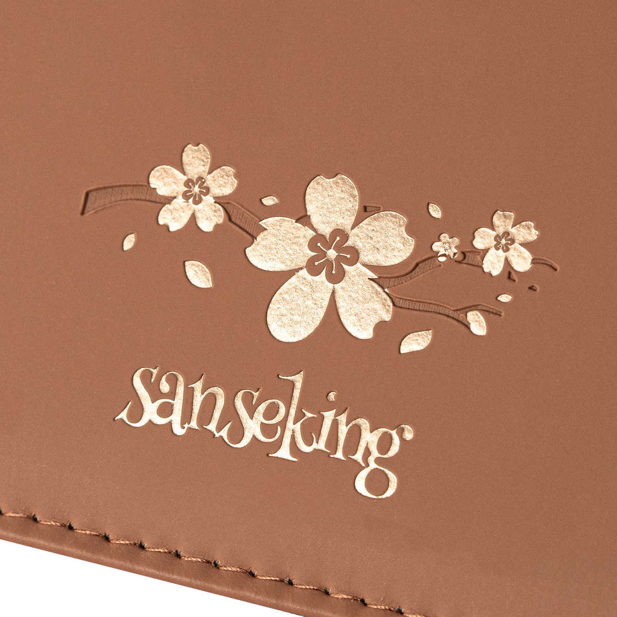 Cherry blossom Sanseking logo detail on the Brown SAKURA card binder