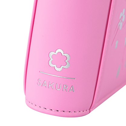 Angled view of the SAKURA emblem on the Pink card binder