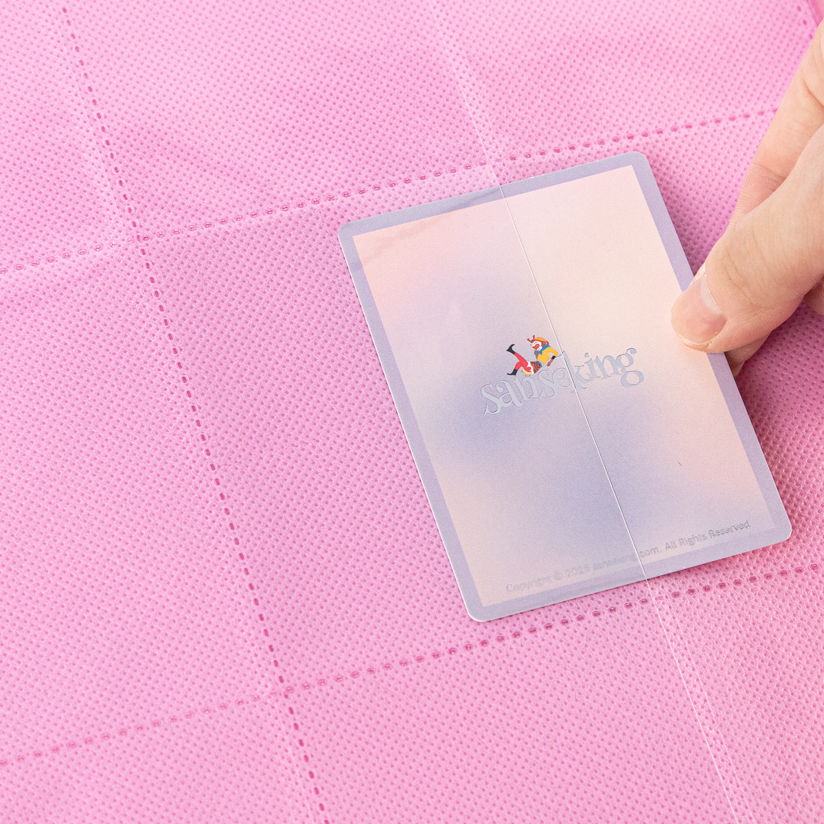 Side-loading pocket holding a sleeved card in the Pink SAKURA binder