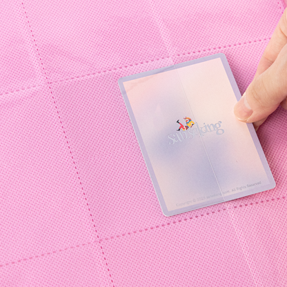 Side-loading pocket holding a sleeved card in the Pink SAKURA binder