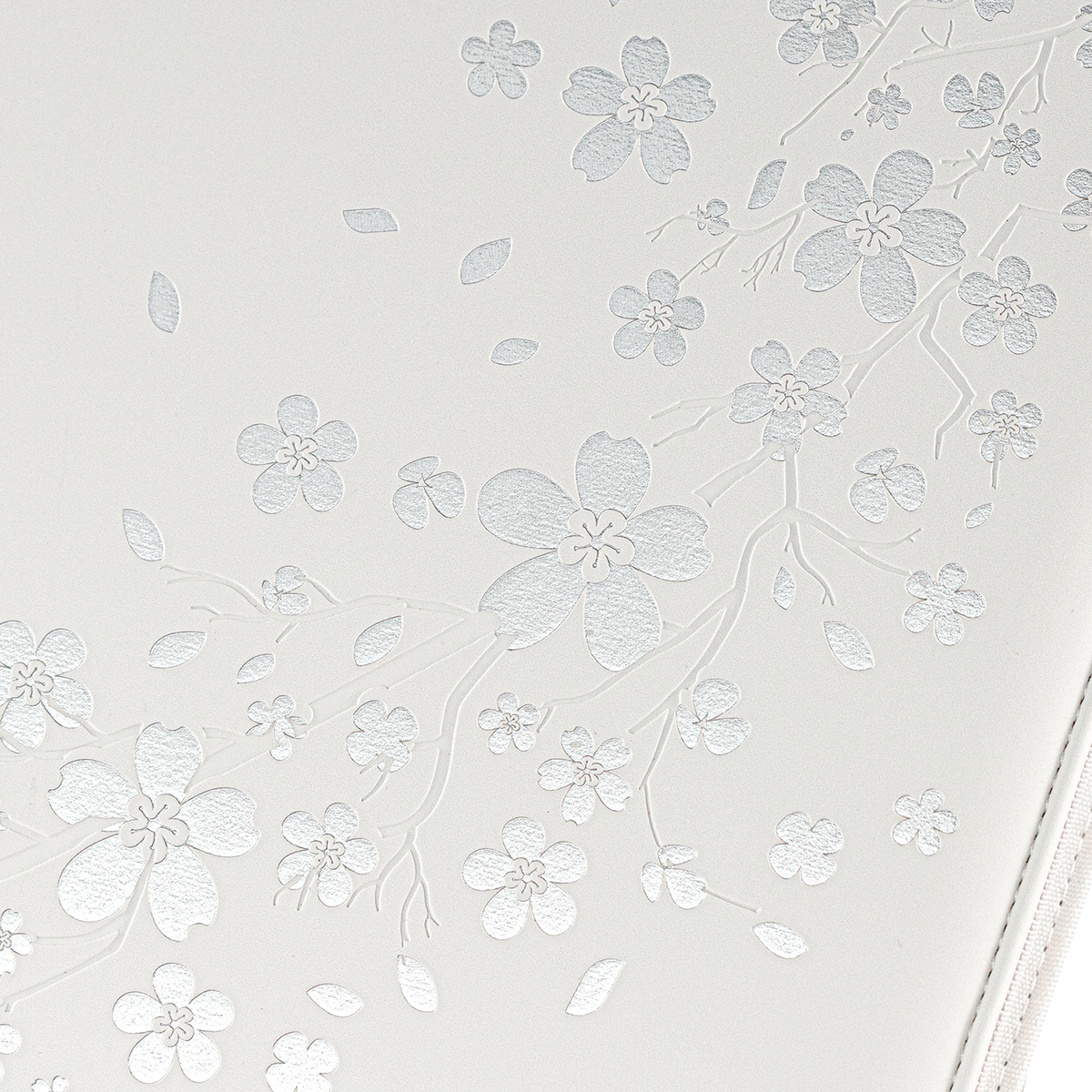Reflective cherry blossom artwork on the White SAKURA card binder