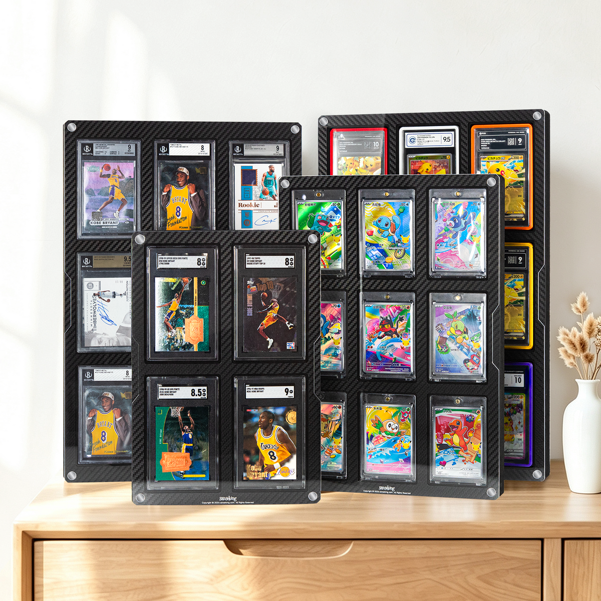 Carbon-fiber-finish card display frames on a shelf