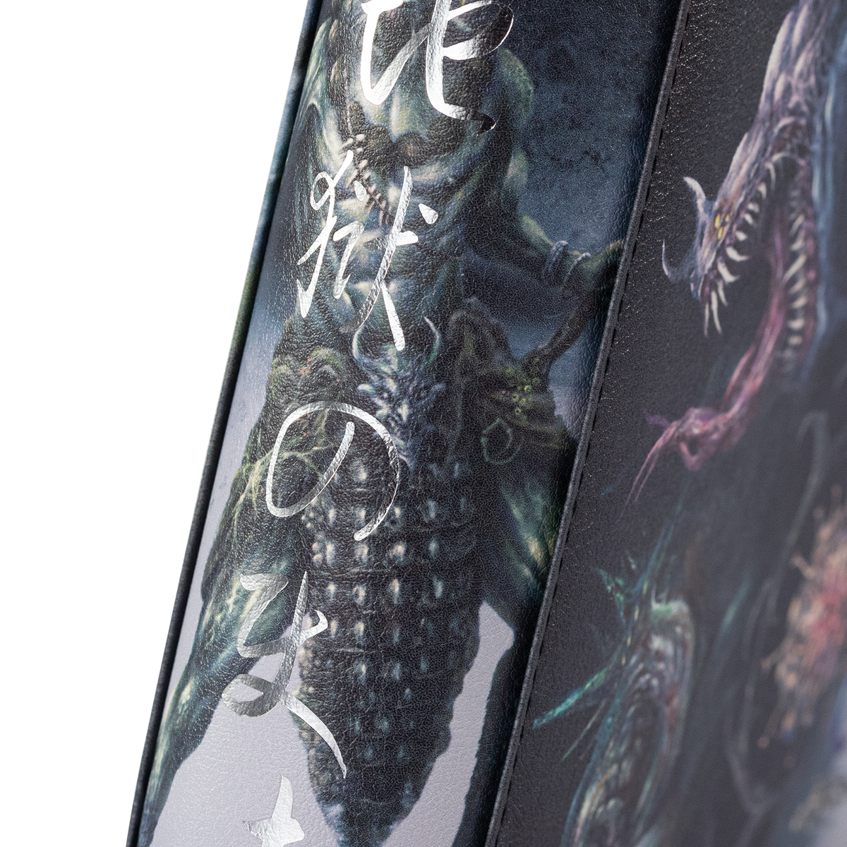 Close-up of the illustrated Hellbringer binder spine