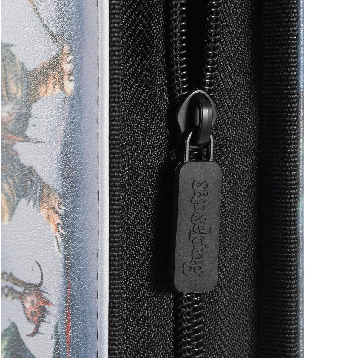 Black zipper and branded pull on the Hellbringer card binder