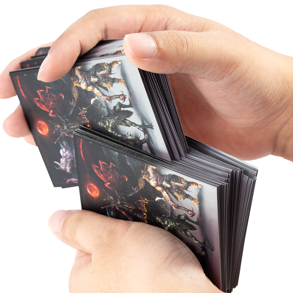Hands shuffling trading cards in Hellbringer sleeves