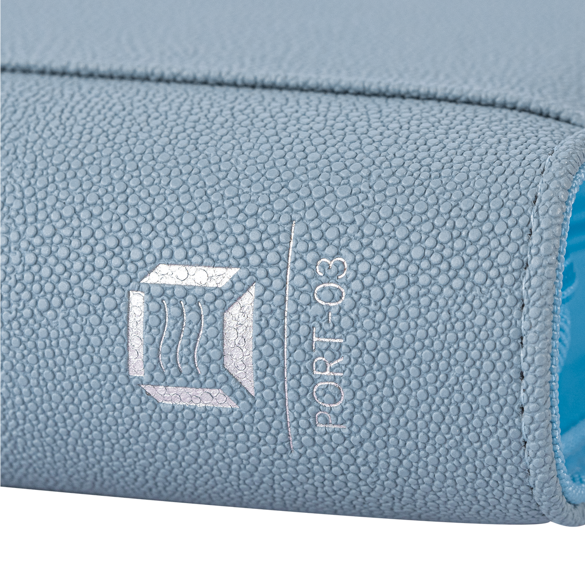 Sanseking PORT Blue 4-pocket toploader binder close-up of the silver model marking