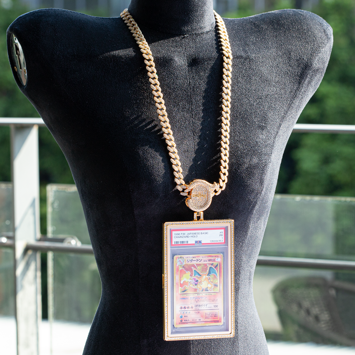 Radiance graded card pendant necklace worn on a display bust outdoors