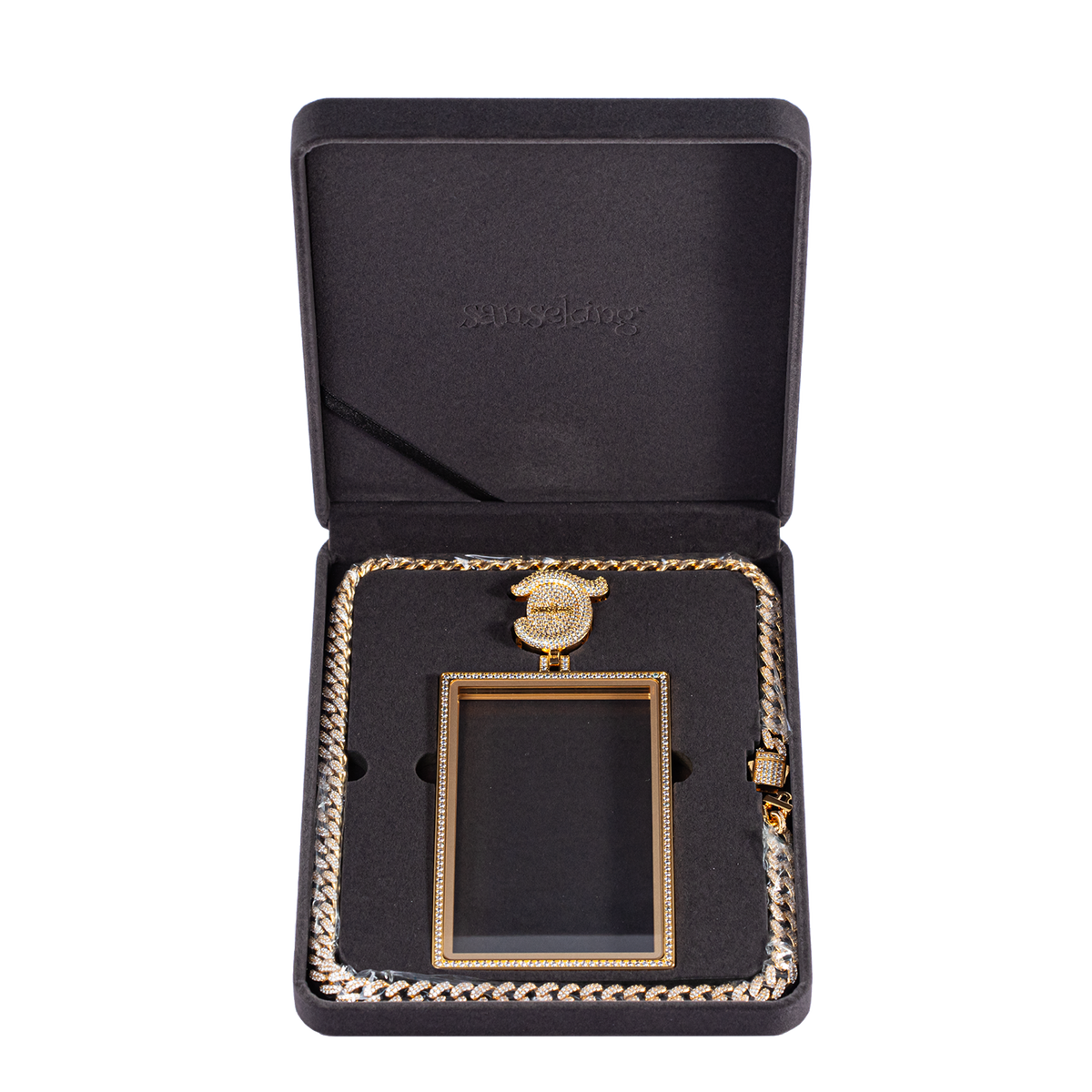 Radiance pendant case and necklace arranged inside open presentation box