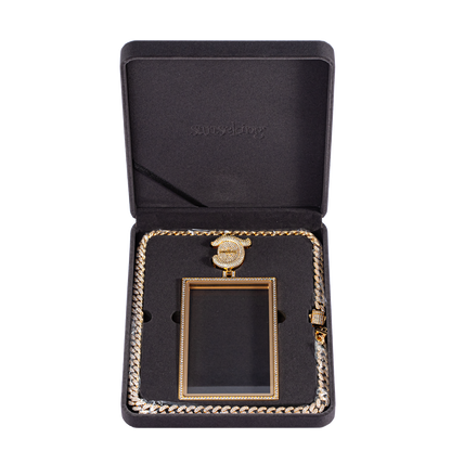 Radiance pendant case and necklace arranged inside open presentation box