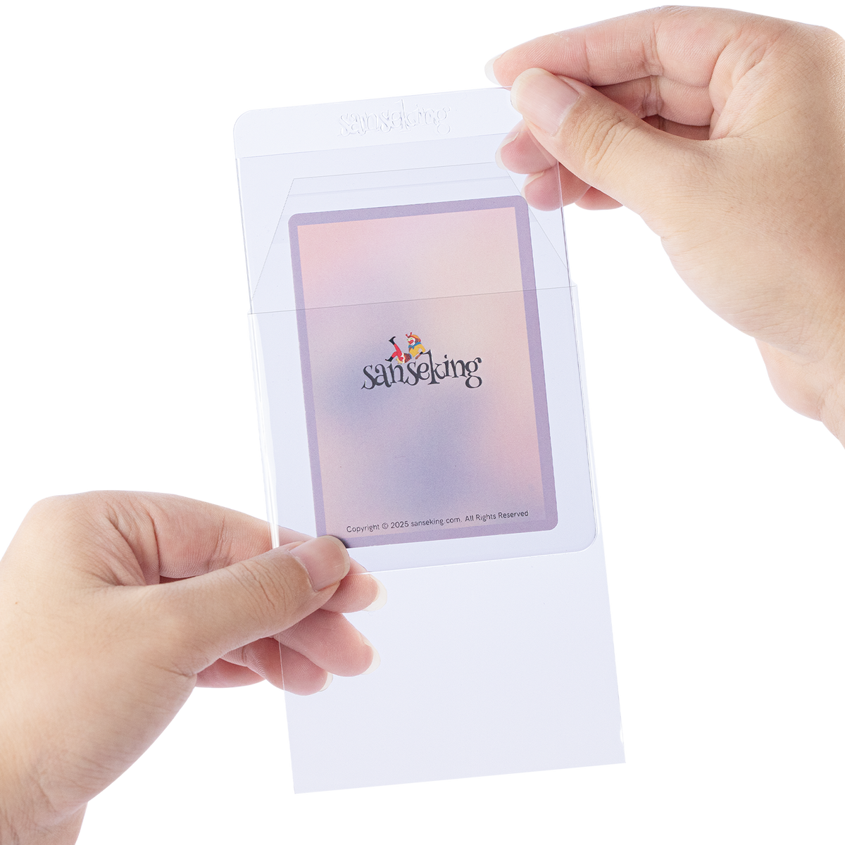 Hand inserting a semi-rigid card holder into a clear resealable protective sleeve