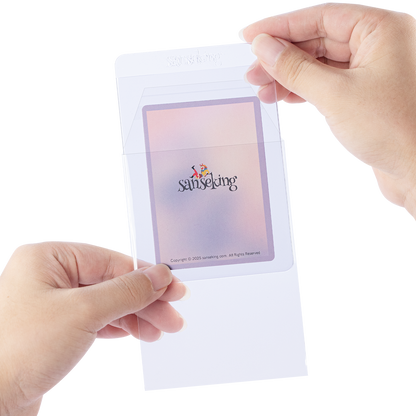 Hand inserting a semi-rigid card holder into a clear resealable protective sleeve